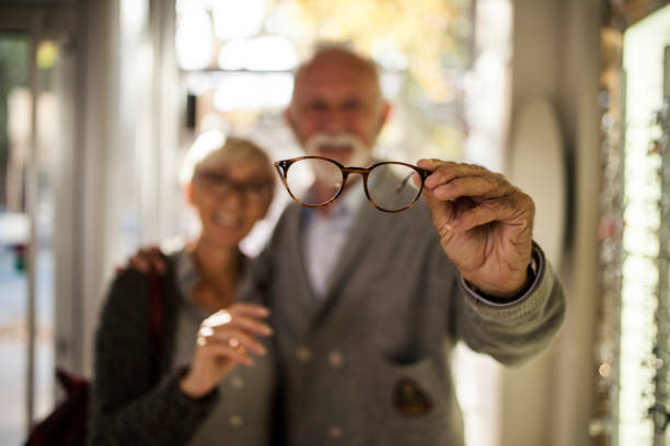 Senior couple shopping for eyeglasses