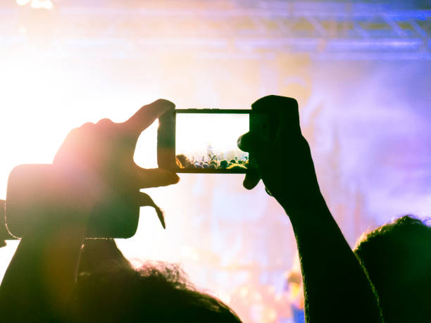istock Filming concert on smart phone 1147644161