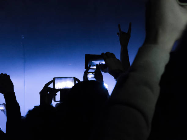 istock Filming concert on smart phone 1147644179