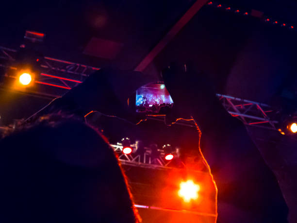 istock Filming concert on smart phone 1147644206