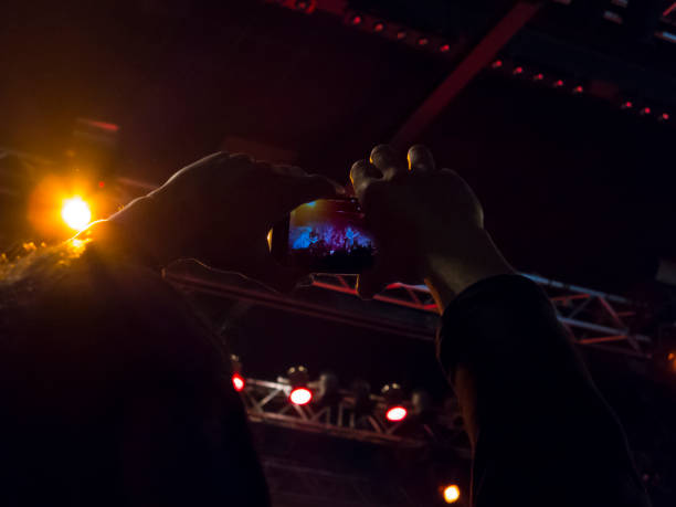 istock Filming concert on smart phone 1147644216