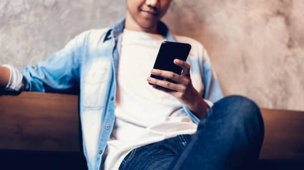istock Man using smartphone, During leisure time. The concept of using the phone is essential in everyday life. 1147653282