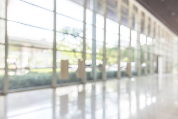 istock Blur office or hotel lobby background interior view toward reception hall, modern luxury white room space with blurry corridor and building glass wall window 1147654583