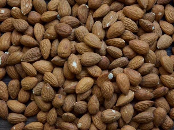 istock Almond with wooden board, nuts 1147664124
