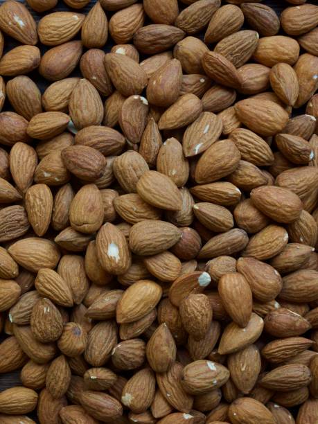 istock Almond with wooden board, nuts 1147664128