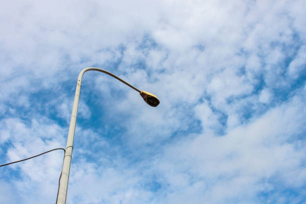 istock fresh clear blue sky with light cloud with street lamp 1147673965