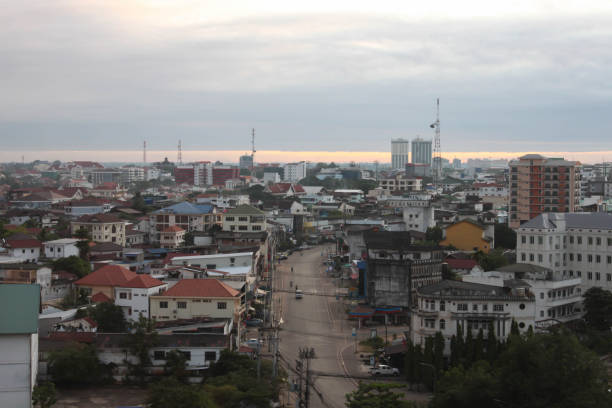 istock cloudy sunrise sky with city 1147673977