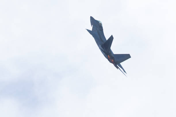 istock F-22 Raptor against the light, with afterburners on 1147675959