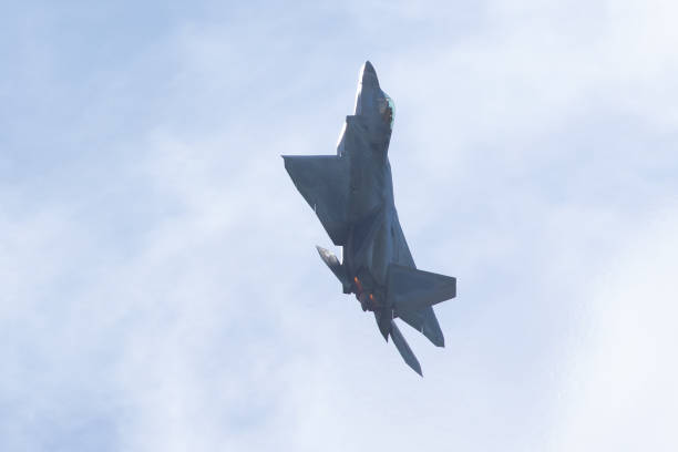 istock F-22 Raptor against the light, with afterburners on 1147675970