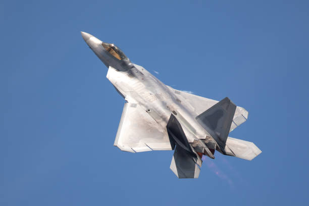 istock F-22 Raptor in beautiful light, with afterburners on 1147676668