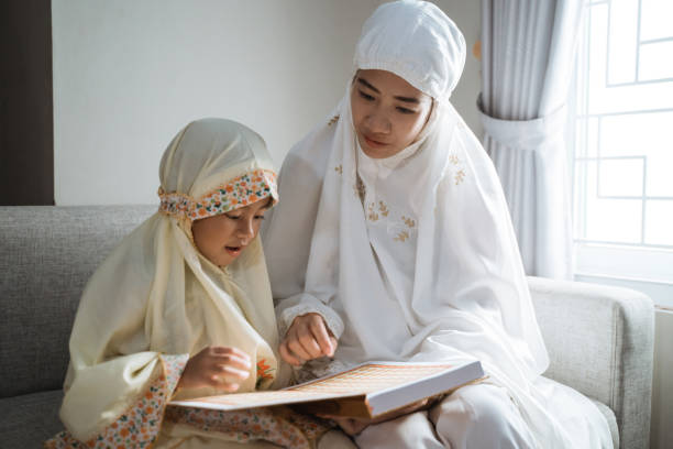 istock mother and kid reading quran 1147681937