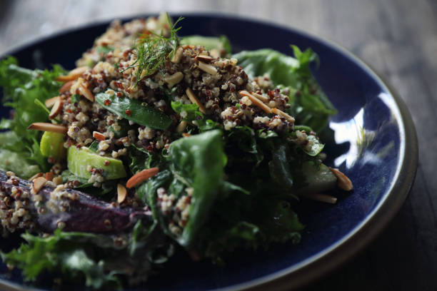 istock Quinoa salad with vegetable on wooden table 1147683611