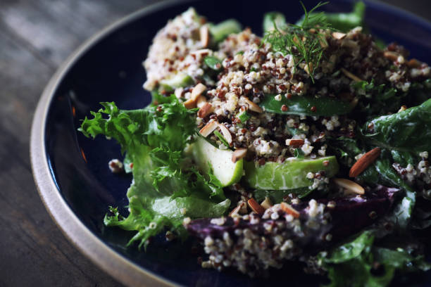 istock Quinoa salad with vegetable on wooden table 1147683612