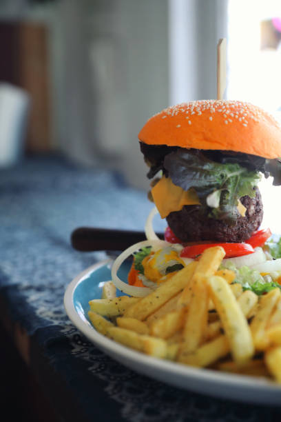 istock Beef hamburger fastfood on wooden table 1147684080