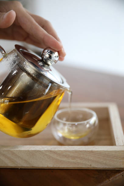 istock Hot teacup with teapot beverage on wooden table 1147684155