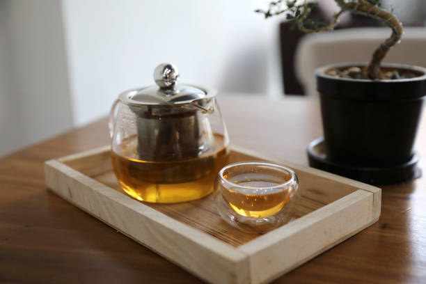 istock Hot teacup with teapot beverage on wooden table 1147684166