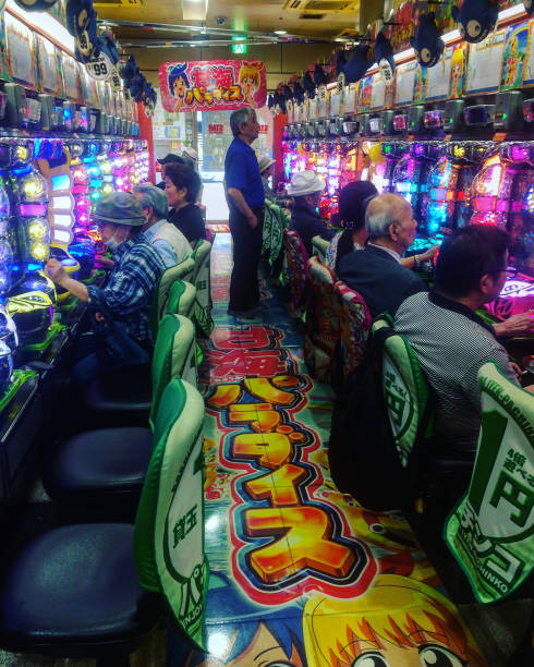 Typical Japanese Pachinko arcade with people gambling stock photo