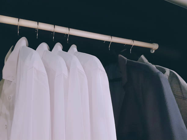 istock Group of Shirts for Men Hanging Inside the Wardrobe 1147690025