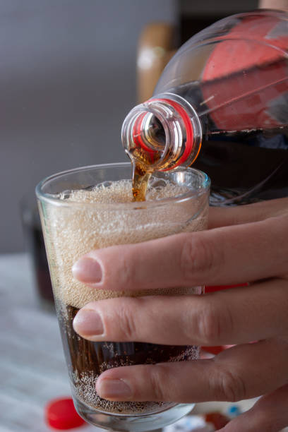 istock Pouring coke in the glass 1147692464