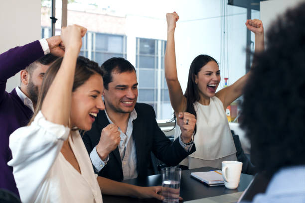 istock Team working celebrating a good business 1147694801
