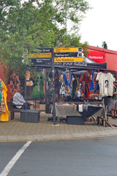 Sign in Soweto Sign for tourist sites in front of a souvenir vendor in Soweto, south of Johannesburg, South Africa apartheid sign stock pictures, royalty-free photos & images