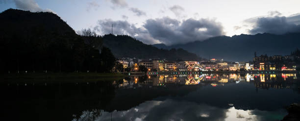 istock Night city landscape view with mountain background and cloudy sky reflection on water located at SAPA, Vietnam 1147696553