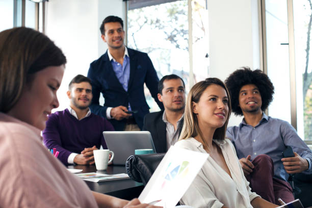 istock Leader of the company explaining the work to be done to his work team 1147700741