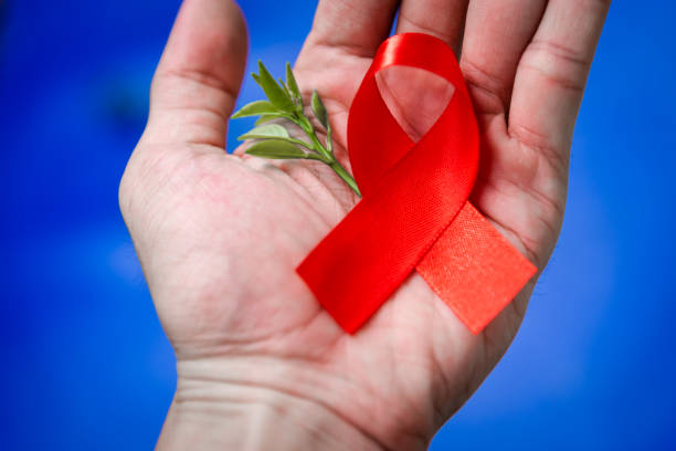 istock Red ribbon for world aids day awareness campaign background. 1147705899