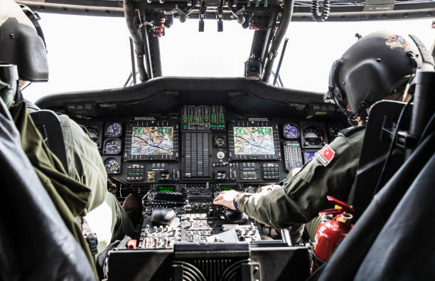 Turkish Army pilot riding military helicopter Ağrı, Turkey - May 04, 2019: Turkish Army pilot riding Sikorsky UH-60 Black Hawk military helicopter. blackhawk stock pictures, royalty-free photos & images