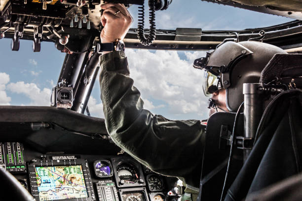istock Army Helicopter Pilot riding Black  helicopter 1147706431