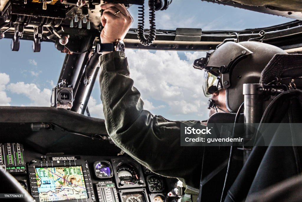 Army Helicopter Pilot riding Black  helicopter Helicopter Pilot Stock Photo