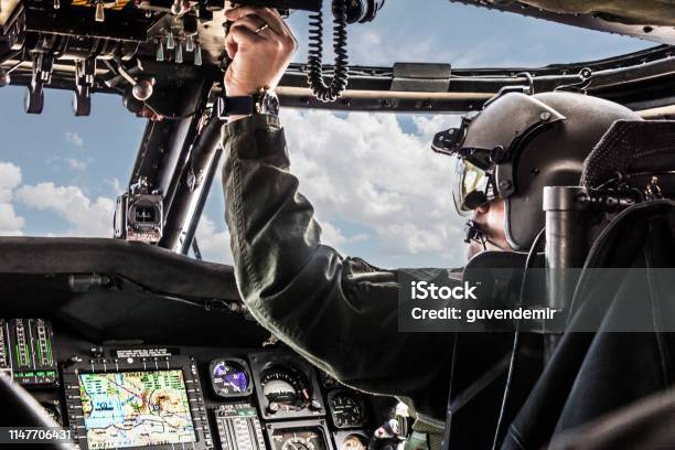 Army Helicopter Pilot Riding Black Helicopter Stock Photo - Download Image Now - Helicopter Pilot, Military, Pilot