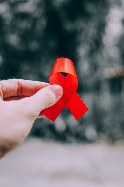 istock Red ribbon for world aids day awareness campaign background. 1147706491