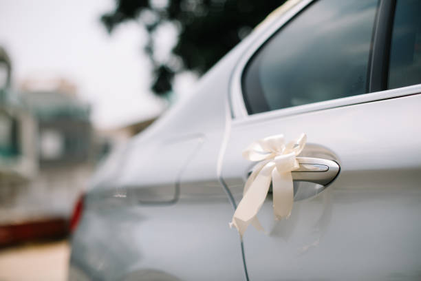 istock Wedding car decoration white ribbon 1147709805