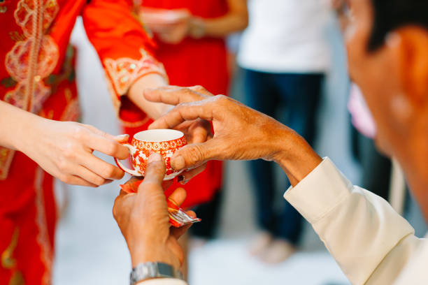 istock Newlywed serving tea to elder on Chinese traditional tea ceremony 1147709825