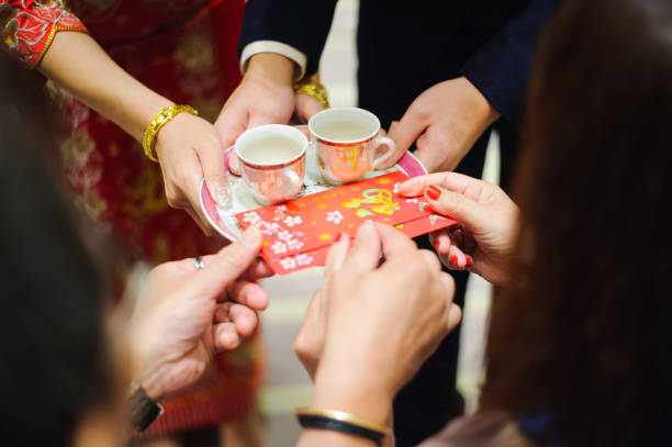 istock Newlywed serving tea to elder on Chinese traditional tea ceremony 1147710735
