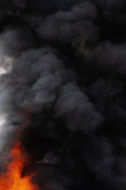 istock Black motion clouds of strong red fire smoke covered sky 1147711303