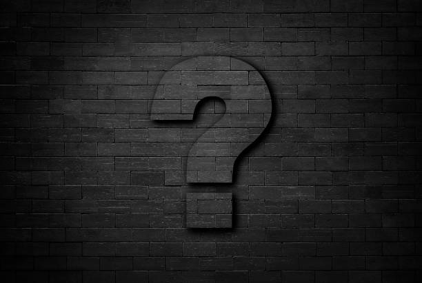 istock Business concept of question mark on black brick wall texture background 1147711505