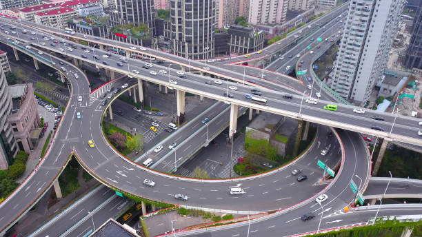 istock Aerial view of highway junctions with roundabout. Bridge roads shape circle in structure of architecture and transportation concept. Top view. Urban city, Shanghai, China. 1147711515