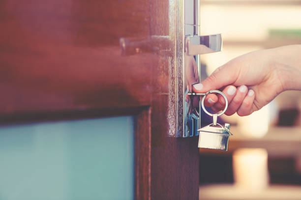 Keys to the apartment in the door, estate concept