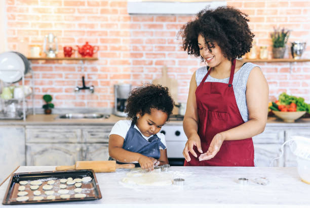 istock Mother and child cooking together 1147713785