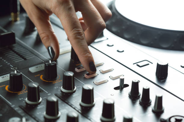 istock DJ playing music at mixer closeup 1147715867