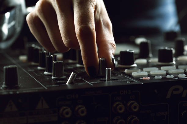 istock DJ playing music at mixer closeup 1147715876