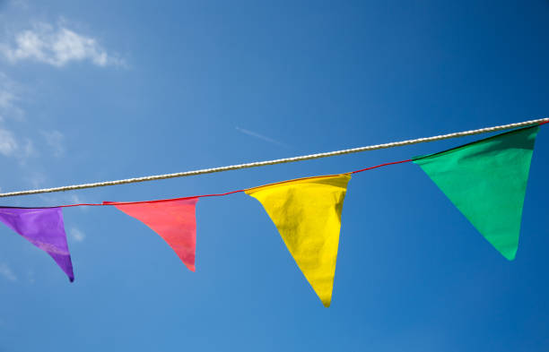 istock color flag on blue sky 1147717101