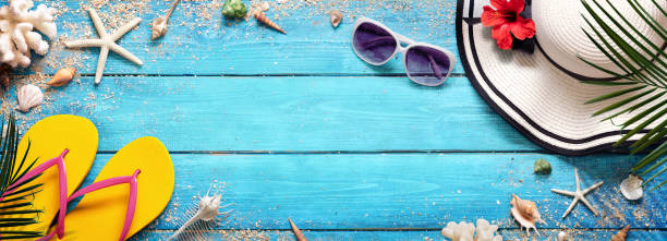 istock Summer Beach Background - Hat And Sunglasses On Blue Plank With Palm And Shells 1147717185