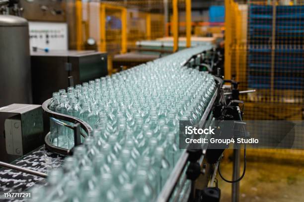 Production Line For Juice Bottling Stock Photo - Download Image Now - Manufacturing, Plastic, Factory
