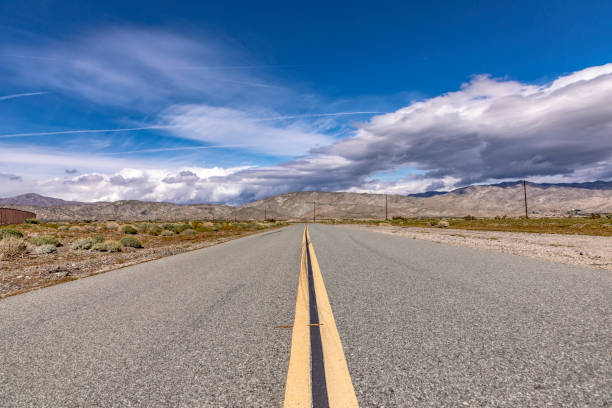 istock driving on a small road in the desert 1147717960