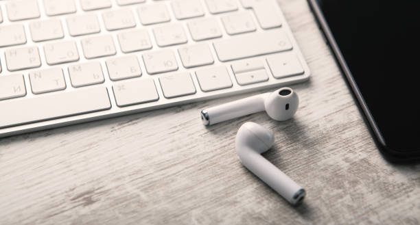 istock Smartphone, wireless headphones and a computer keyboard. Technology 1147718633