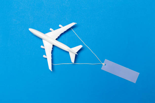 istock model of passenger plane on blue background 1147721333