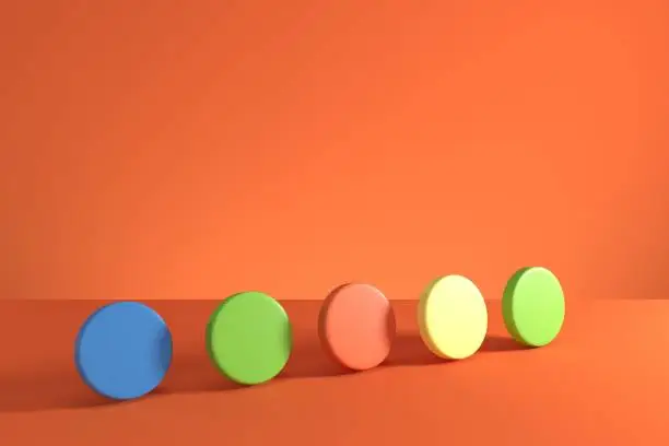 Photo of Colorful cylinders on orange background. Minimal concept idea. 3D Render.